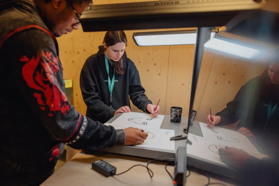 Ravensbourne students using study space with animation and sketching facilities