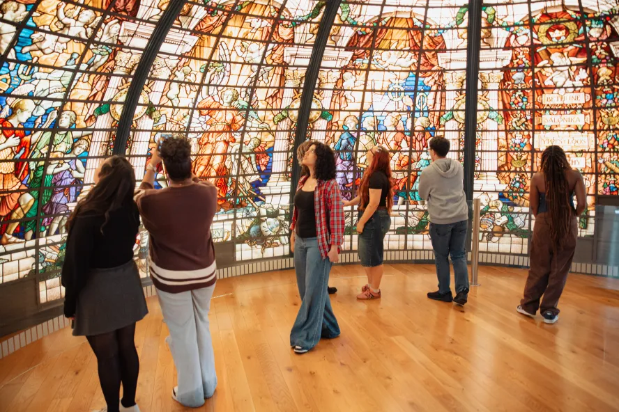 Students in a museum viewing art in maritime