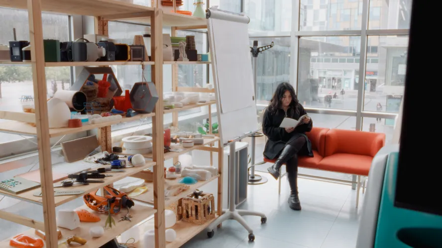 Student reading in a workshop