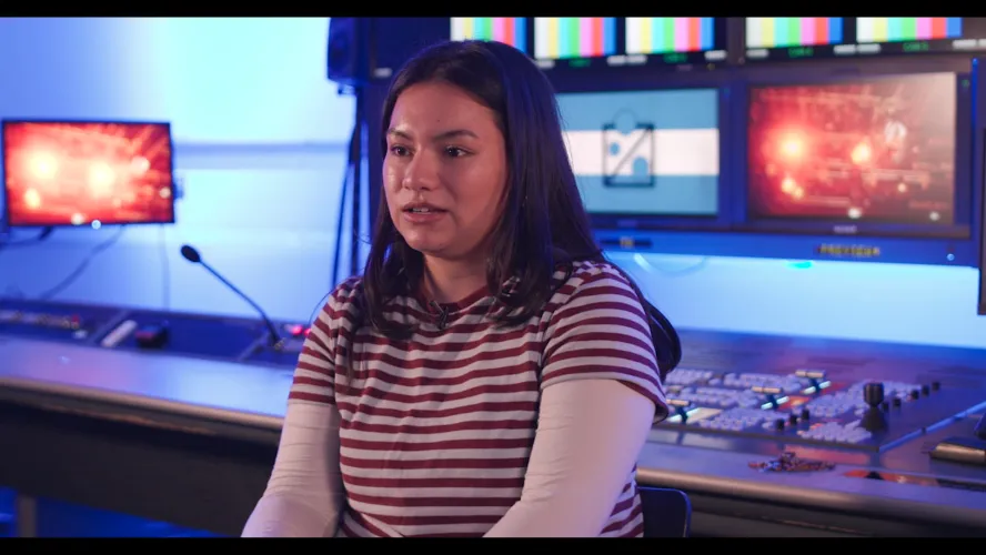 Tia Packwood being interviewed in Ravensbourne TV studios about her time studying Digital Television Production