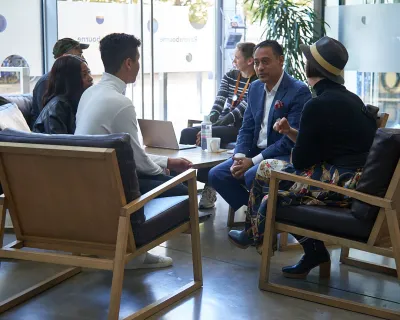 Guests discuss sessions during break