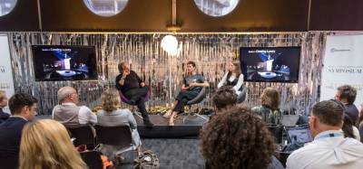 A panel of speakers talk at a MDes event