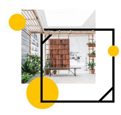 a photograph of a new building covered in wood and glass