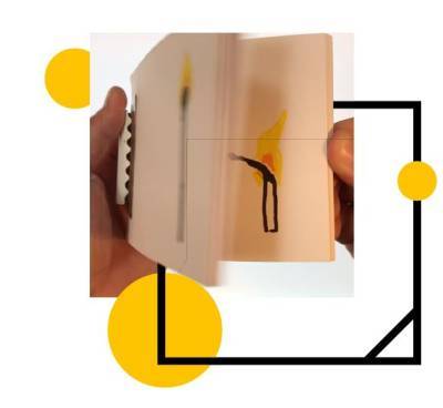 a photo of a cartridge flipbook being opened by hands in the background