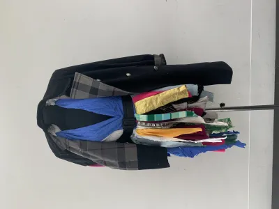 A mannequin with a garment made of multi coloured scraps of material on
