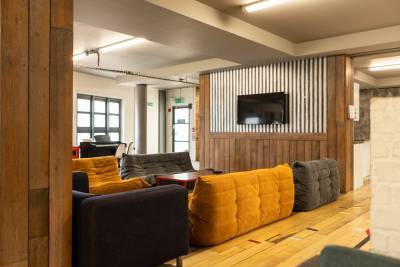 Common room with sofas and TV screen