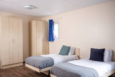 Twin studio with two beds and cupboards