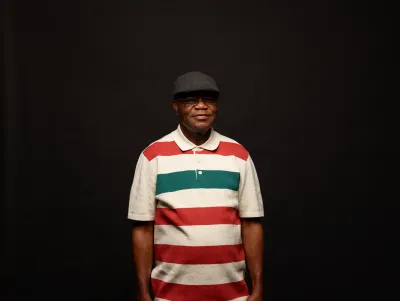 man in a cap and stripy top