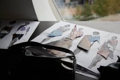 a4 paper with collage dresses on female forms