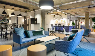 Large open plan, modern communal area with seating. 