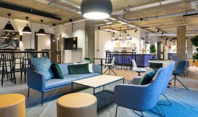 Large open plan, modern communal area with seating.