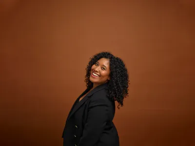 Almasi looking over her shoulder and smiling 