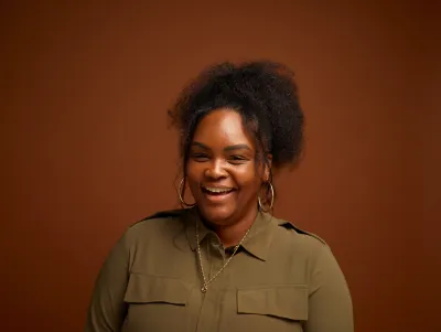 Danni laughing and smiling at the camera