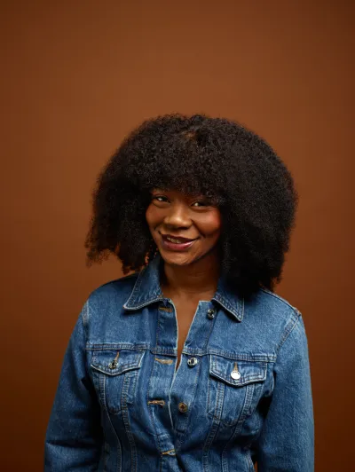 Joanne smiling at the camera