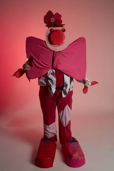 Clown with large bow and huge red nose
