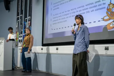 Presenters giving a talk to students