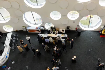 Aerial view of students and academics at a Degree Show food stall