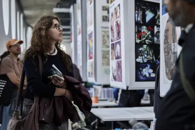 woman looking at student work